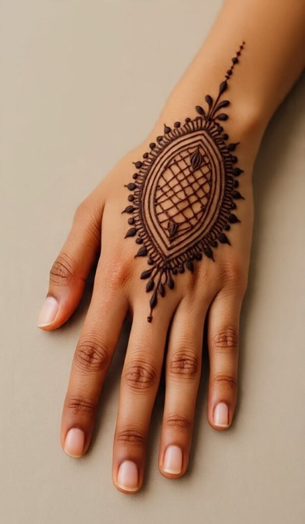 There is a beautiful mehndi design on the hand, with a big flower and leaves in the middle